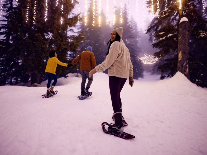 three people snowshoeing