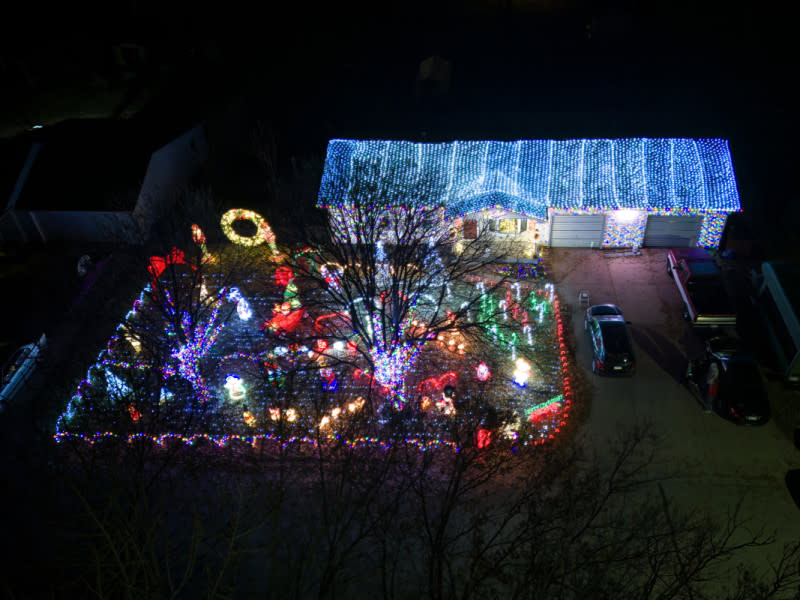 Christmas lights cover the roof and decorate the front yard of a home on Lockwood street.