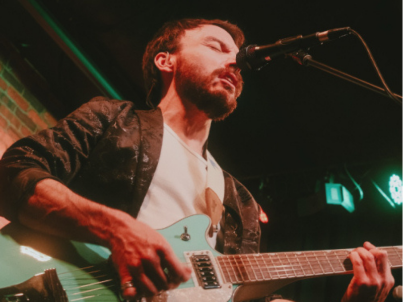 Guys playing the guitar