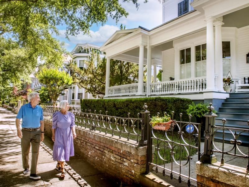 Couple walking past historic homes in downtown Wilmington