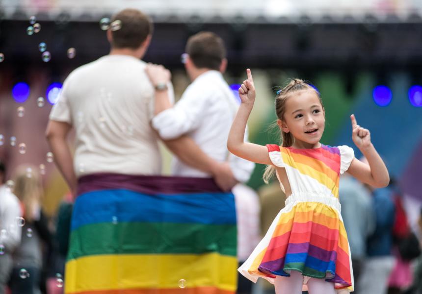 Child dancing in rainbow dress at the SC Pride Festival