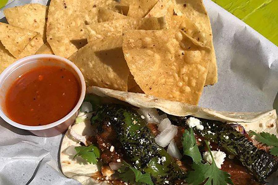 Photo of taco and chips at Cartel Taco Bar