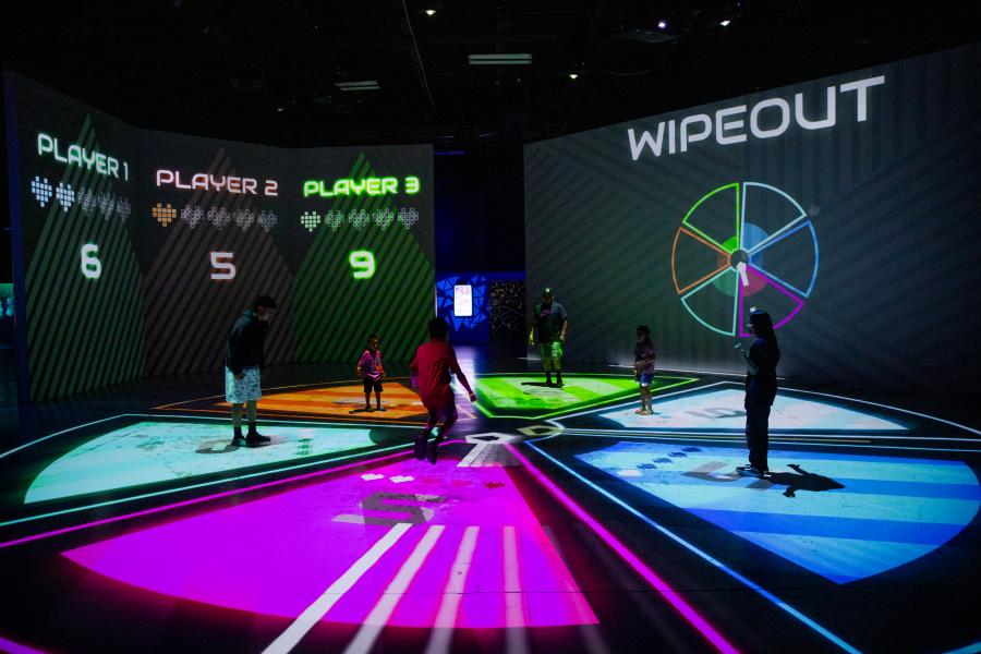 A family plays a game at Electric Playhouse