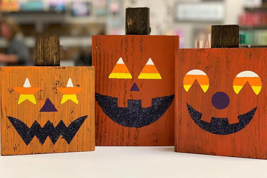 Photo of wood painted like pumpkins from Board and Brush