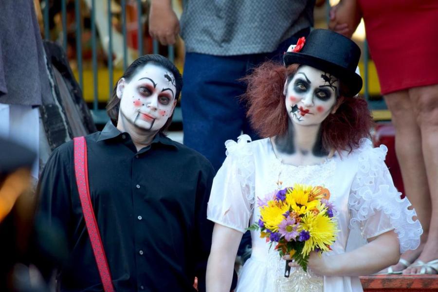 Two people in Halloween makeup for Six Flags Over Texas Frightfest