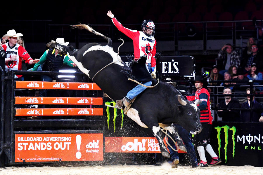 Photo of PBR team member from Canada riding bull