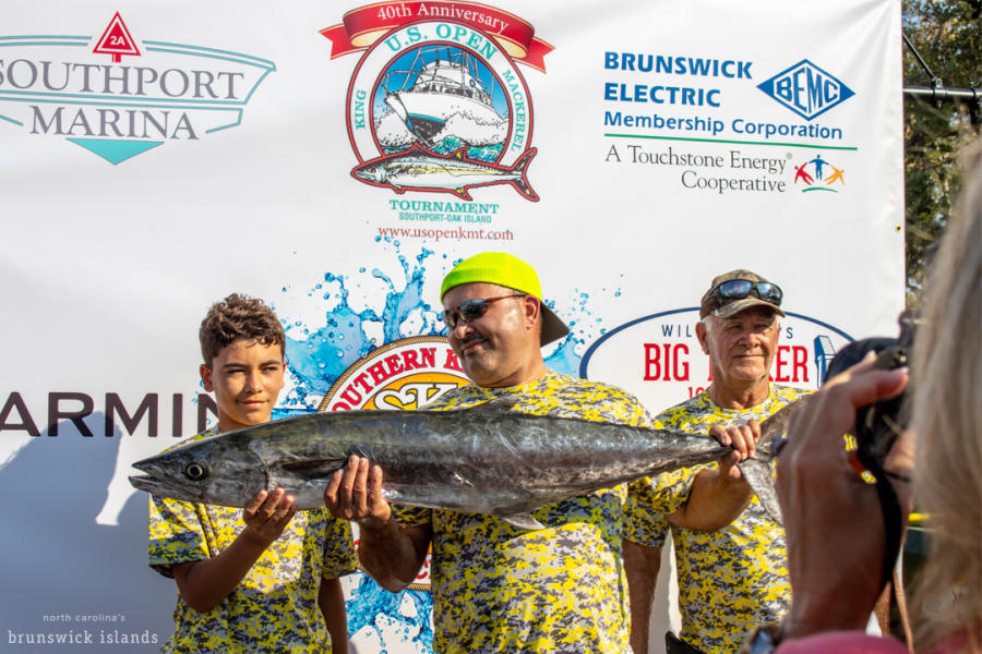 three people holding a king mackerel for a photo at the US Open King Mackerel Tournament in 2018