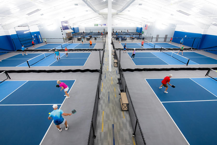 people playing at an indoor pickleball facility