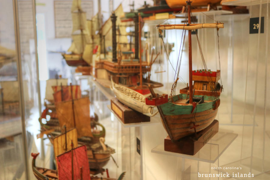 an exhibit of wooden model ships