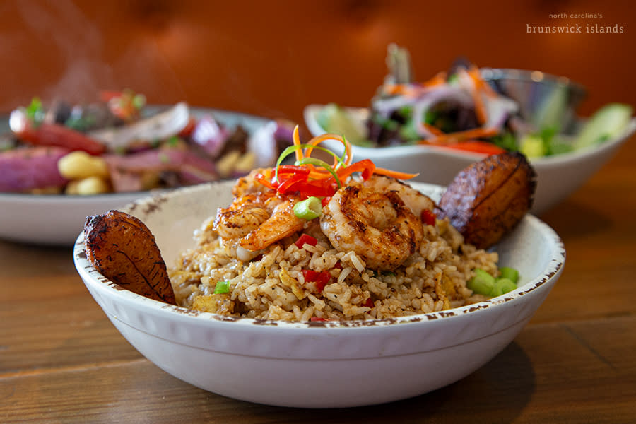 a bowl of Peruvian fried rice (Chaufa) topped with shrimp from Aroma's at the Beach in Sunset Beach, NC