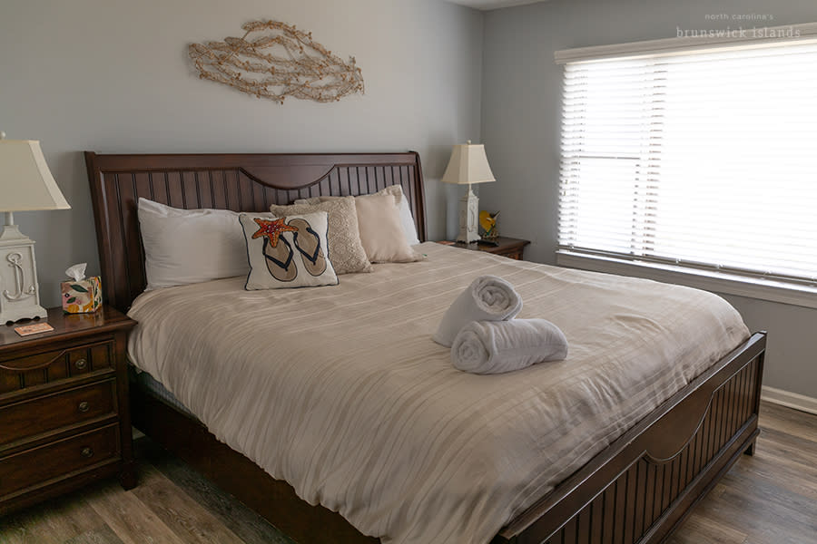 a queen sized bed in a vacation rental