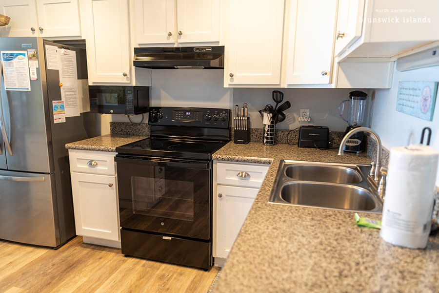 a fully equipped kitchen in a vacation rental home