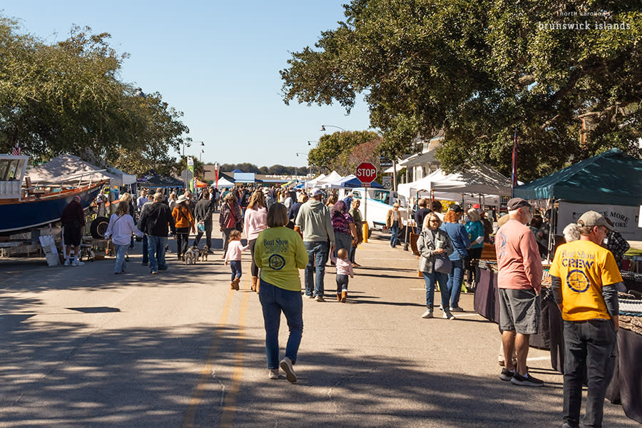 a crowd at an outdoor festival in downtown Southport