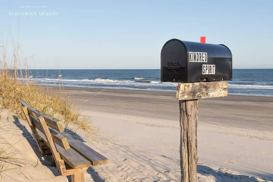A black mailbox named Kindred Spirit on the beach in Sunset Beach, NC