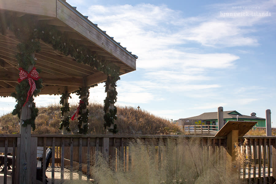 a wooden gazebo decorated with Christmas decorations on Sunset Beach, NC