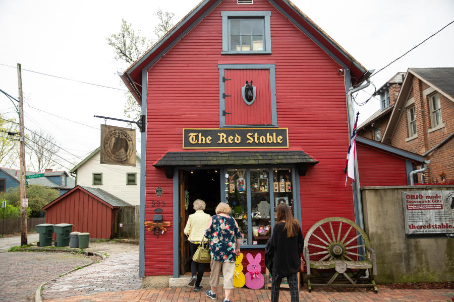 Women walking into The Red Stable