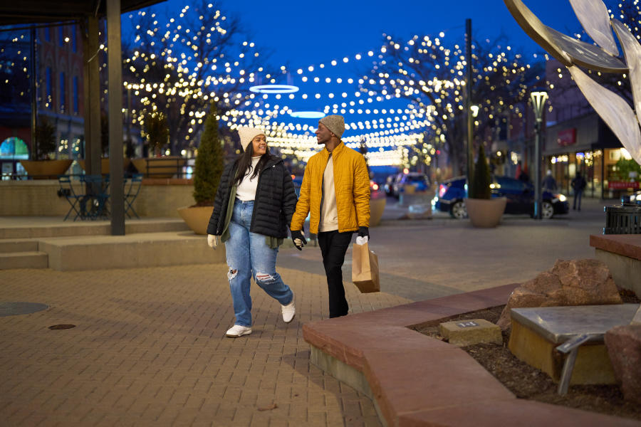 Couple walking and shopping through downtown in winter