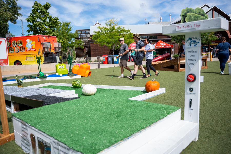 A few folks playing Dude Dad Mini Golf at New Belgium.
