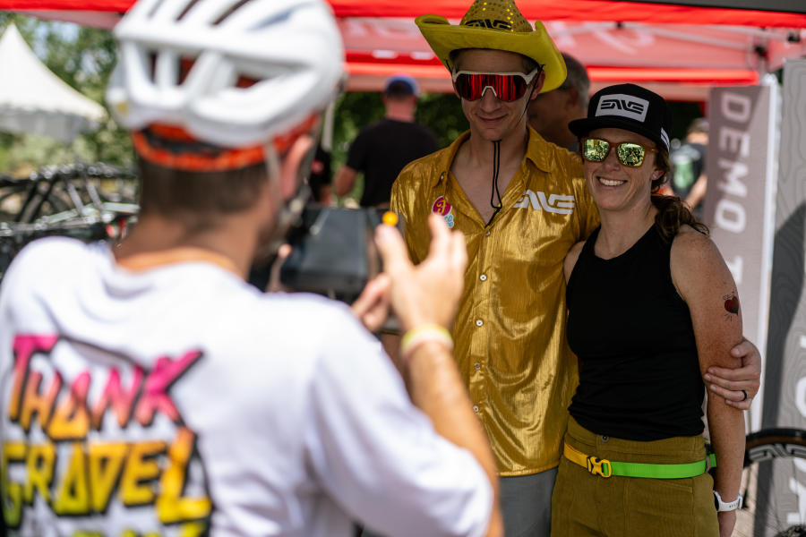 Two people posing for a photo at the expo of FoCo Fondo