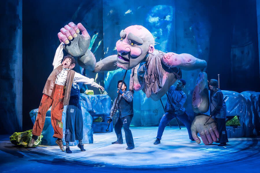 IMage shows part of the production of The BFG with characters on stage