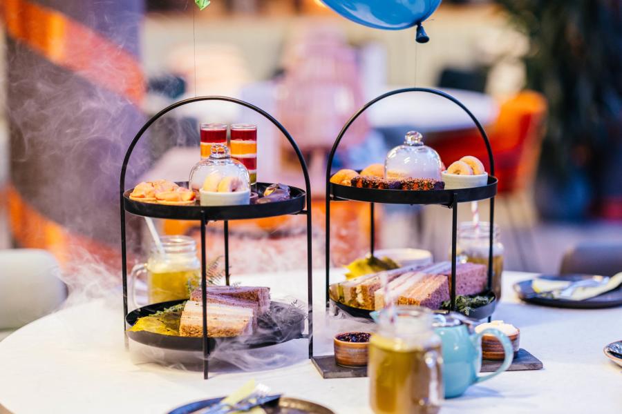 Photograph shows cake stands and drinks making up the BFG afternoon tea at Chichester Festival Theatre