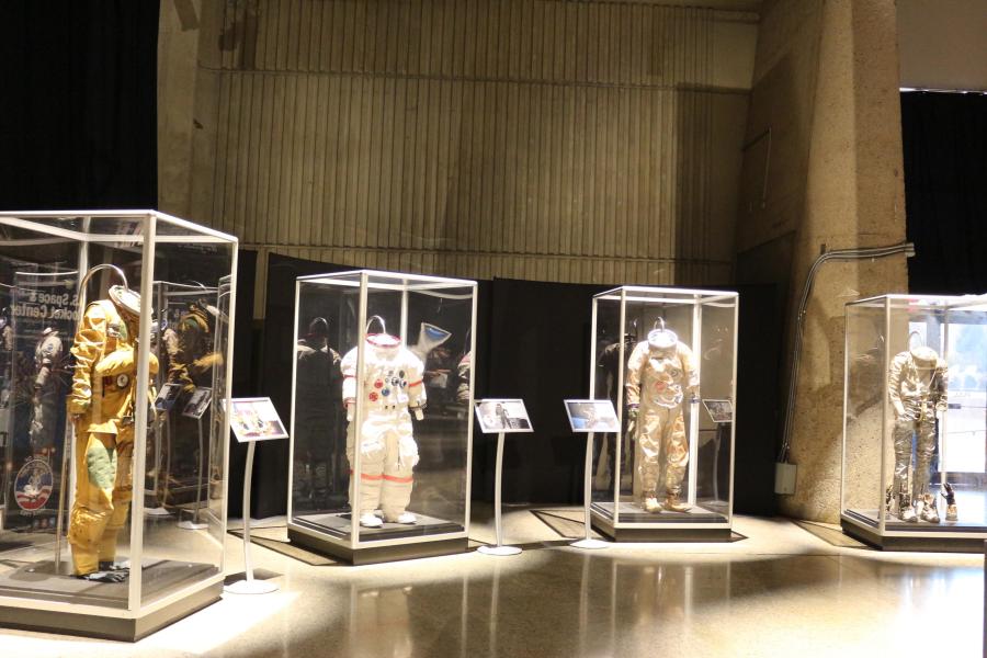 Cases showcasing astronaut suits at the U.S. Space and Rocket Center