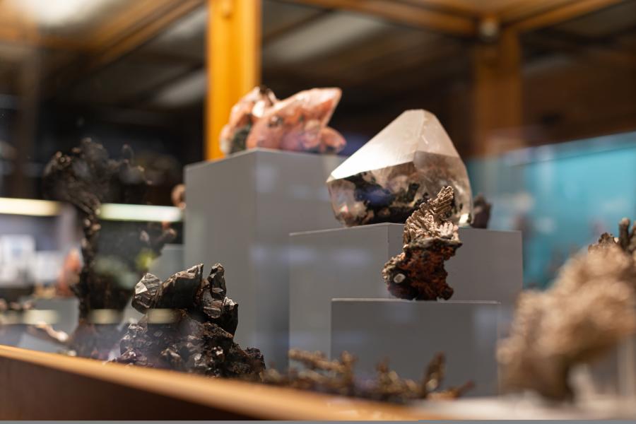 Precious gemstones in a glass case at the A.E. Seaman Mineral Museum in Houghton