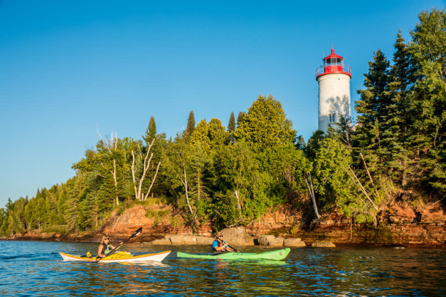 Kayakers paddle near the Jacobsville Lighthouse