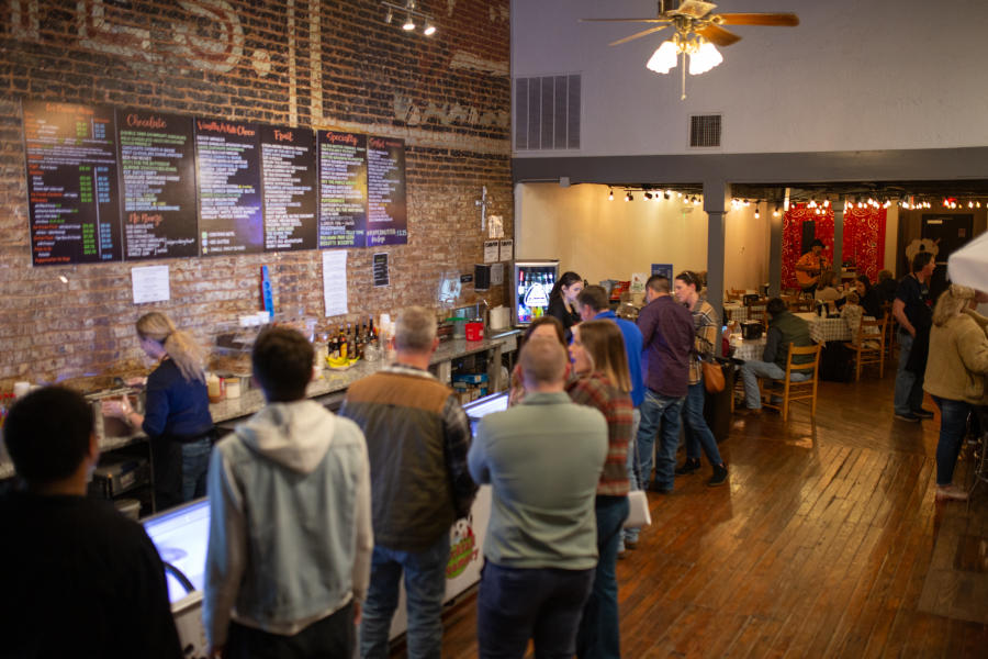 ice cream parlor with a long line at the counter