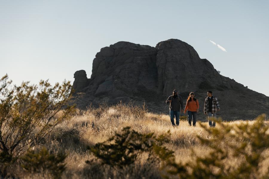 Three people hike near Rockhound State Park, New Mexico