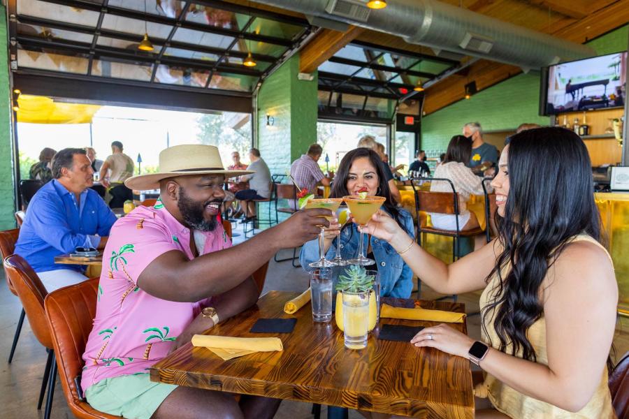 friends toasting at the 1501 gastropub