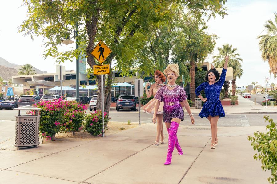 Three drag queens walking on Arenas Road in Palm Springs