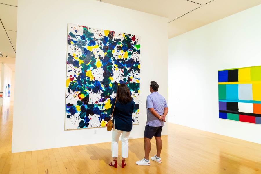 A couple looking at a painting at the Palm Springs Art Museum