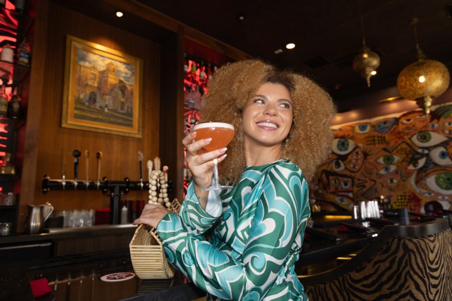woman holding cocktail drink at tac/quila in palm springs