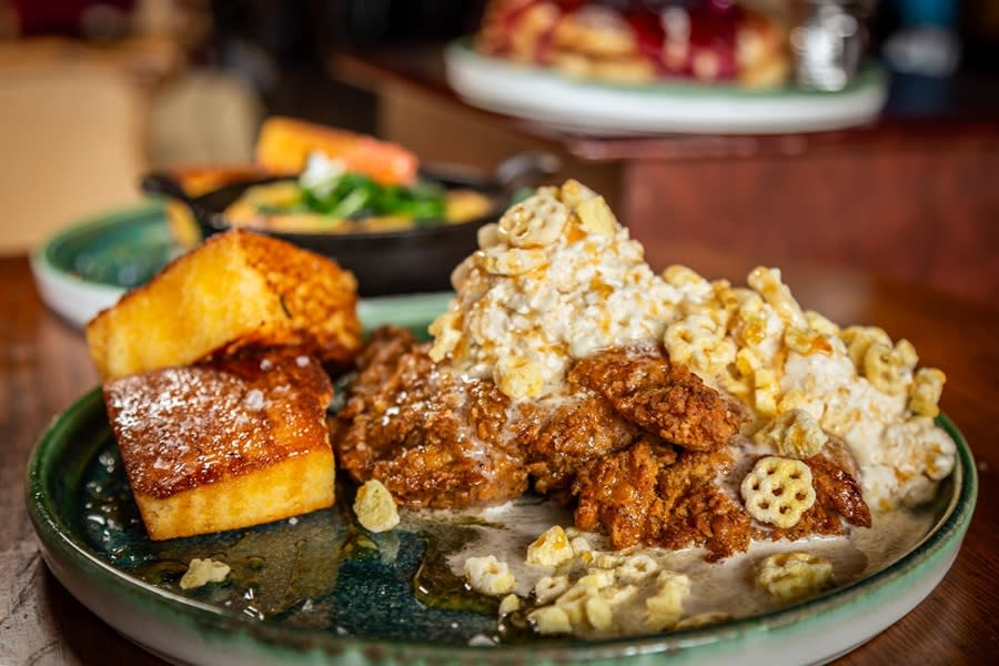 Revelry's Honey Butter Fried Chicken with waffle crisp-honey butter and 2 pieces of honey corn bread