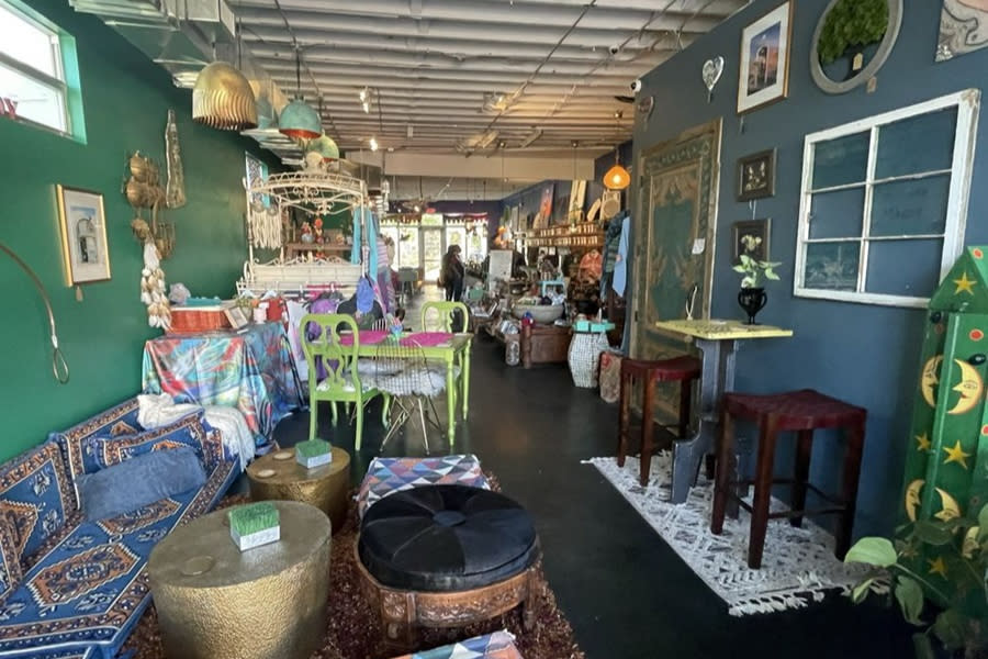 A cozy tea house, eclectically decorated with whimsical items.