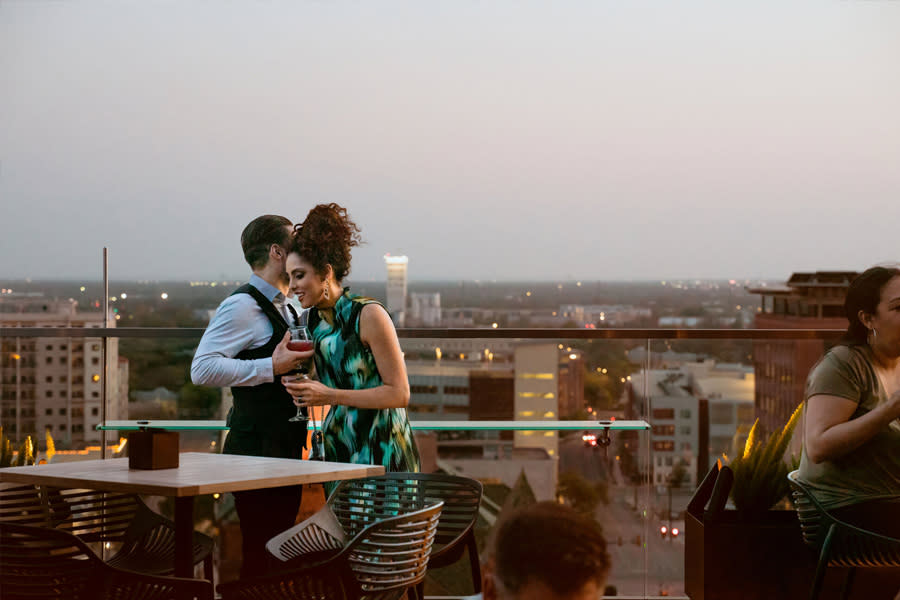 Couple on rooftop bar