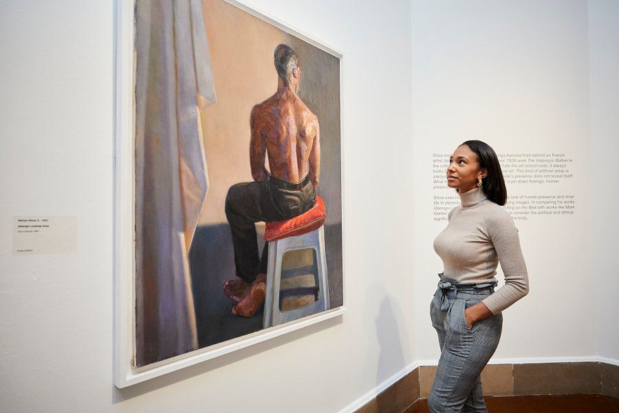 Lady looking at a painting inside City Art Gallery