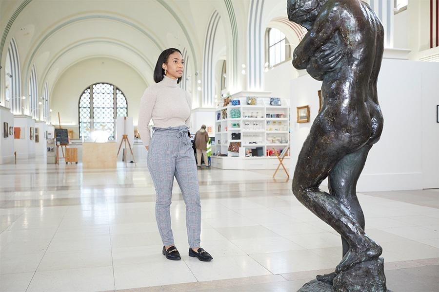 Lady looking at a large sculpture inside Southampton City Art Gallery