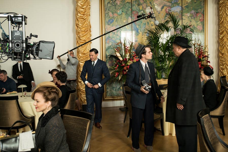 Actors and cameras working on set in the brangwyn hall swansea