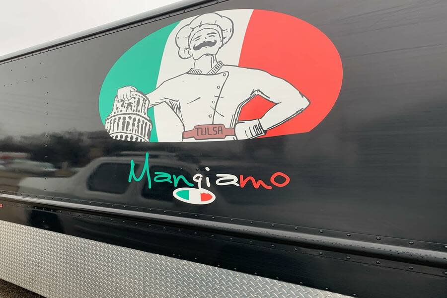 The logo on the exterior of Mangiamo food truck in Tulsa, OK.
