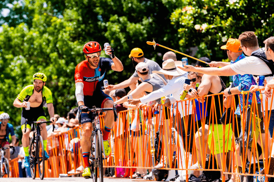 Bikers racing on Cry Baby Hill during Tulsa Tough while attendees watch from the sidelines