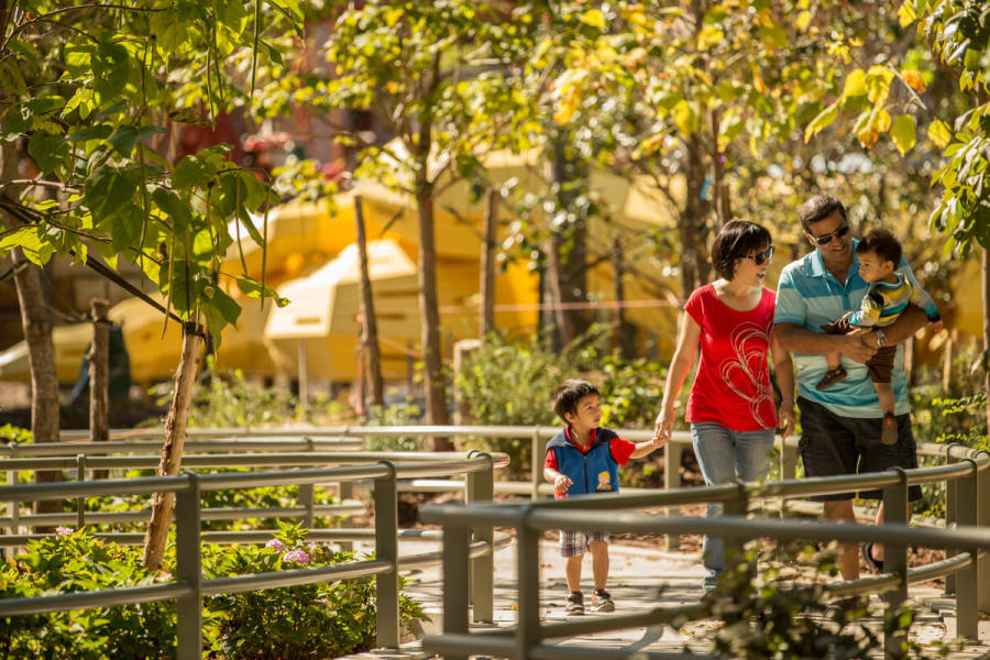 A Family Enjoying The Plant-lined paths at the Gathering Place
