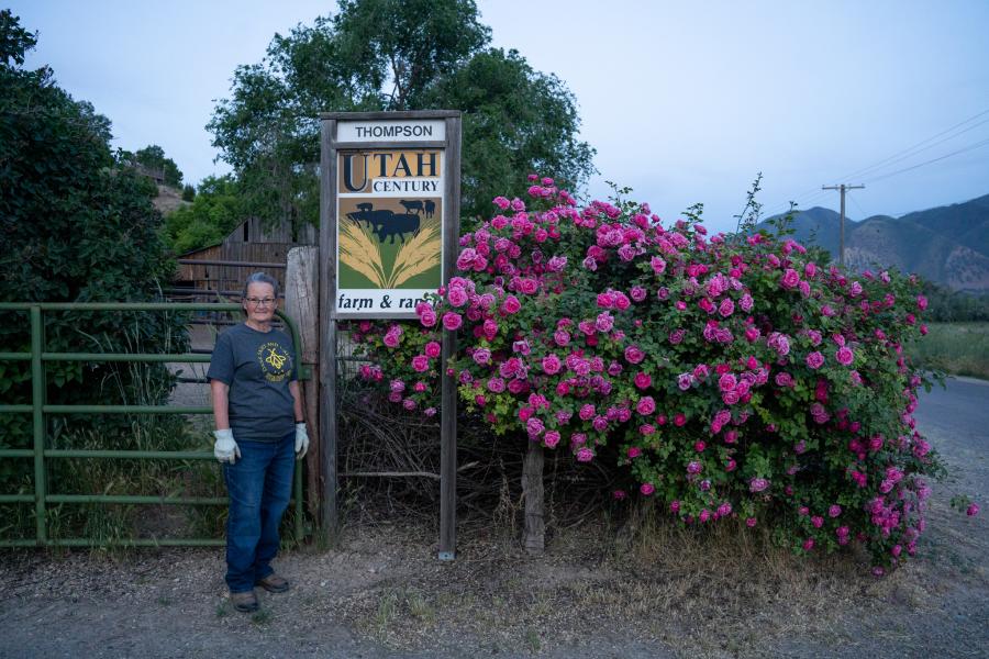 Diane Garcia standing in front of her farm