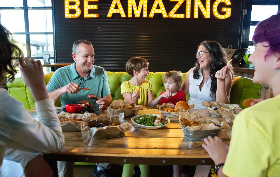 family eating at Chicken N Pickle