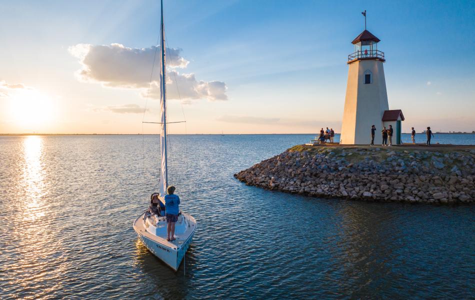 A sailboat sailing on the lake