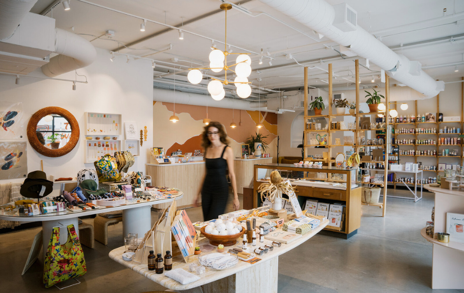 Woman walking in Social Club gift boutique