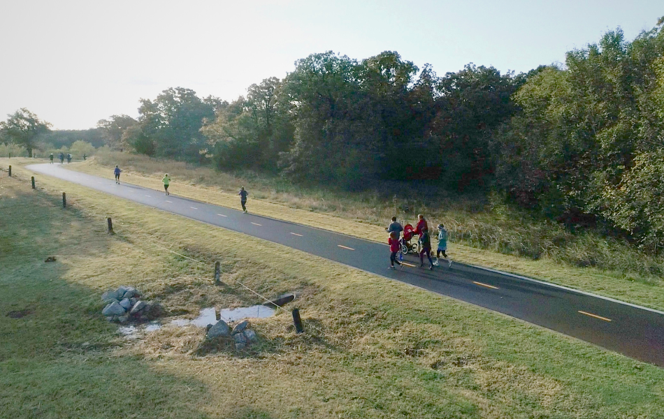 Trail near Lake Stanley Draper where people are riding bikes and running