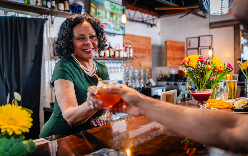 Victoria Kemp serving people at the bar at Florence's