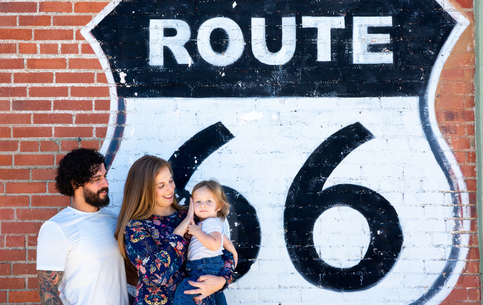 Family in front of Britton Road Route 66 Shield Mural
